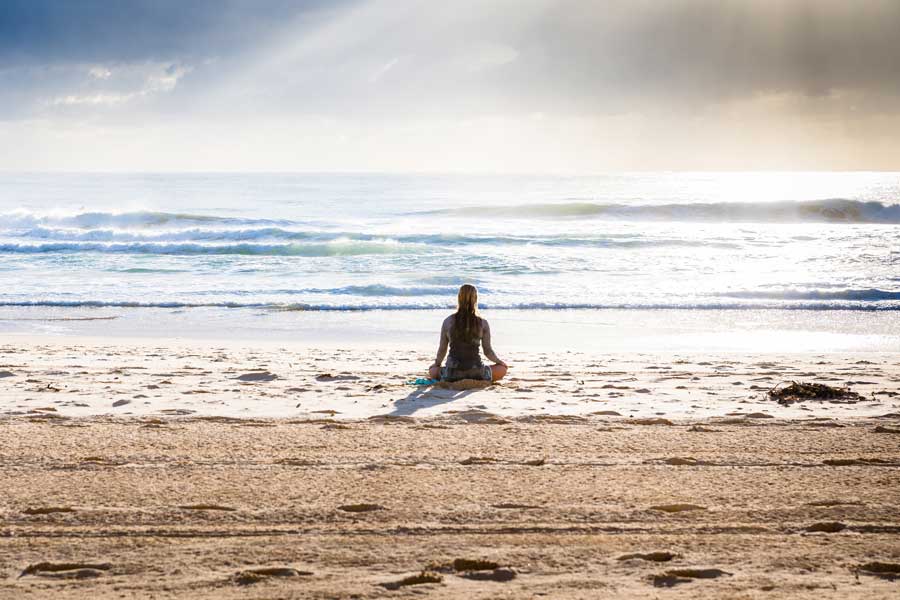 woman standing on the shoreline